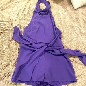 Brand new open back purple romper.